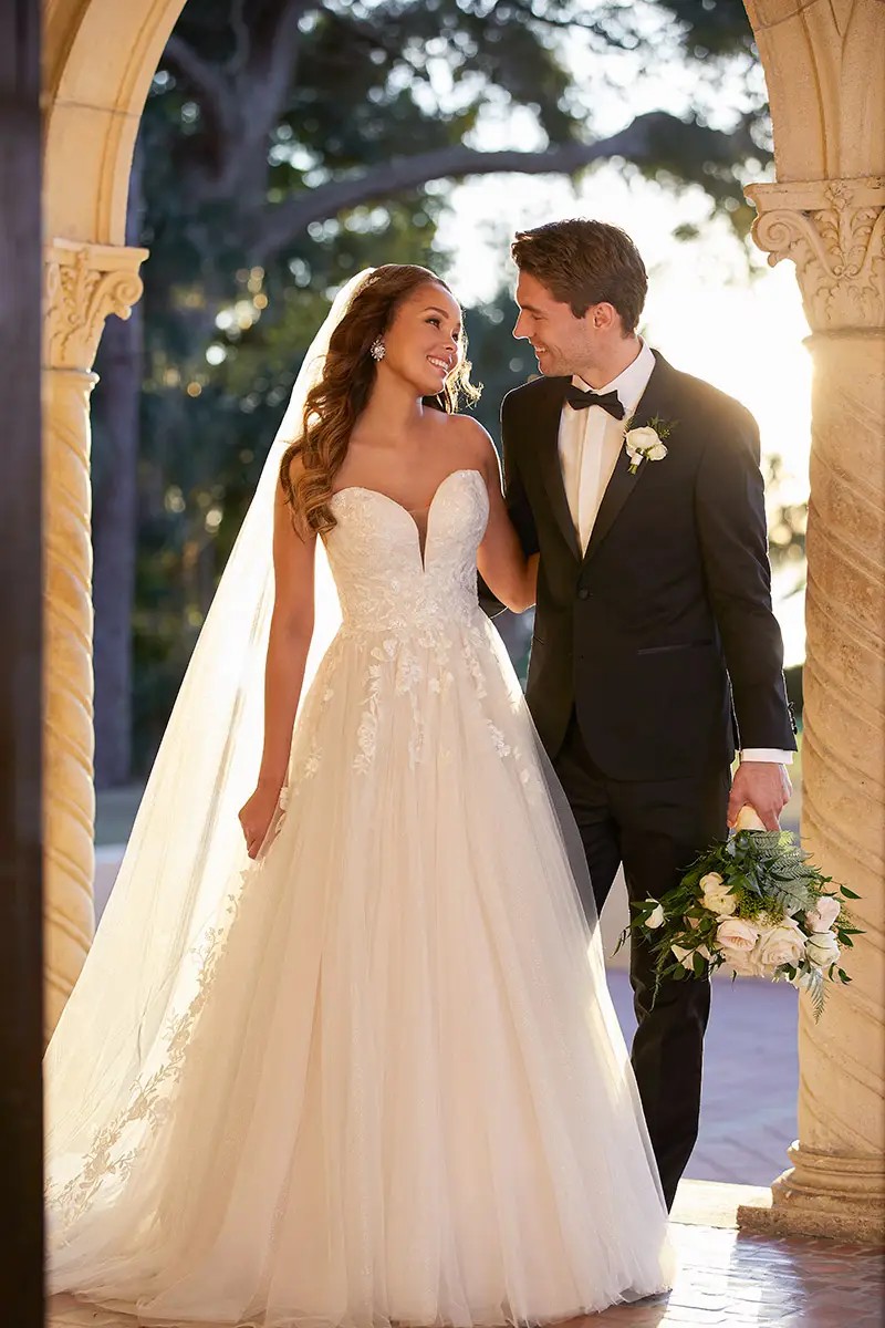 Model is wearing a strapless sweetheart wedding dress by stella york