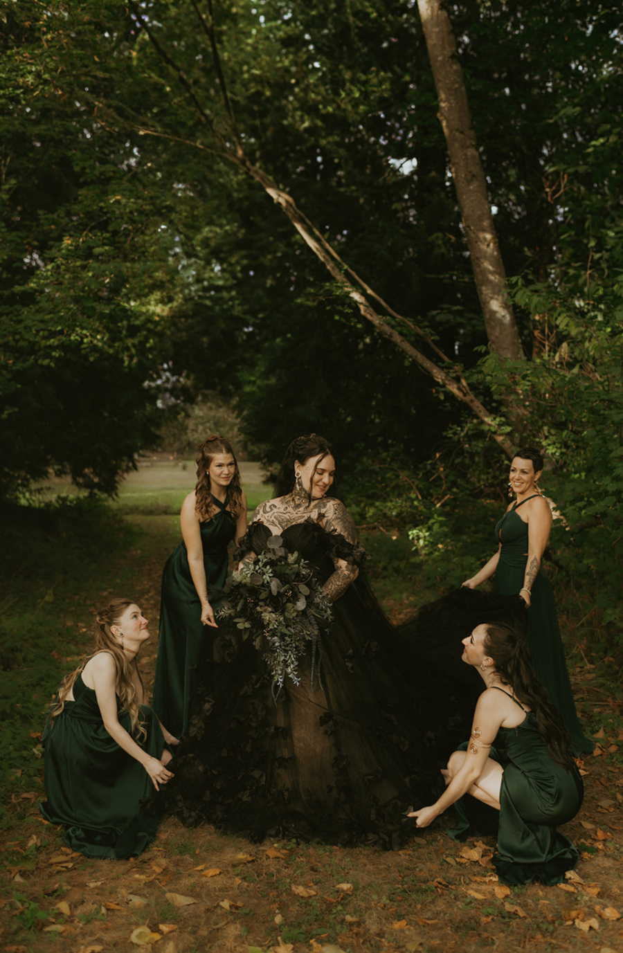 model is wearing a black lace a-line bridal gown